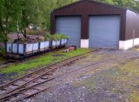 Any electrical engineers out there will recognize this as the 'earth line'. Civil engineers wagons outside the carriage shed at Alston on 22 May 2014.<br><br>[Ken Strachan 22/05/2014]