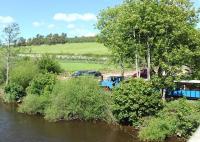 Looking across the River Till, Northumberland, on 20 May as a train departs from Heatherslaw Mill bound for Etal Castle on the Heatherslaw Light Railway, hauled by Alan Keef 2-6-0T <I>Bunty</I>.<br><br>[Peter Todd 20/05/2014]