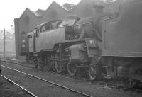 Standing alongside the shed at Dalry Road on 28 March 1964 is BR Standard tank no 80022. In the background is Fairburn 42273, a regular on station pilot duties at nearby Princes Street [see image 33025].<br><br>[K A Gray 28/03/1964]