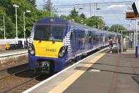 Almost at the end of its journey, ScotRail 334033 on an Edinburgh Waverley to Helensburgh Central service calls at Cardross on 31 May 2014.<br><br>[John McIntyre 31/05/2014]