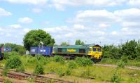 Freightliner 66502 with an eastbound container train at Didcot on 12 June 2014. Unfortunately the locomotive went on to suffer a brake fire at Tilehurst, resulting in closure of the GW main line for approximately two hours.<br><br>[Peter Todd 12/06/2014]