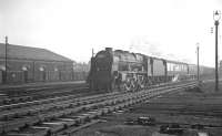 Royal Scot 46128 <I>The Lovat Scouts</I> approaching Carlisle from the south past a busy looking Crown Street goods depot on an overcast 22 December 1962. The train is the  9.35am Liverpool Exchange - Glasgow Central.<br><br>[K A Gray 22/12/1962]