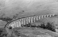 View east over Glenfinnan Viaduct in 1961. The train is the 5.40pm from Mallaig, complete with observation car. <br><br>[David Stewart //1961]