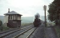 Looking south through the remains of Crawford station on 10 July 1965, just 6 months after closure. The train approaching is a down CTAC special hauled by Black 5 no 44798.<br><br>[John Robin 10/07/1965]