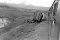 Aftermath of a derailment photographed from a train crossing Rannoch Moor on 6 September 1961. The mishap had occurred several days earlier resulting in a large number of sleepers being torn up. The van had carried alumina.    <br><br>[David Stewart 06/09/1961]