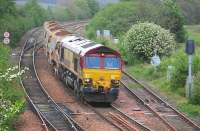 DBS 66111 approaches Inverkeithing East Junction on 28 May with empty autoballasters from Aberdeen Ferryhill to Millerhill.<br><br>[Bill Roberton 28/05/2014]