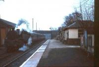 Looking along a deserted platform at East Kilbride in April 1966 with a train of empty stock standing on the left. The line straight ahead to Hunthill Junction, Blantyre, closed as a through route as long ago as 1937 although the section serving the Mavor & Coulson sidings survived until 1966. [See image 19680]<br><br>[G W Robin /04/1966]