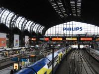 The imposing train shed of Hamburg Hauptbahnhof shelters three very different trains on 11th June. To the right is a Deutsche Bahn IC (Intercity) service, while in the middle is a Metronom double-decker on regional duties - superficially the latter looks like a private operation, but the company is actually owned by the three German Laender (states) of Bremen, Hamburg and Niedersachsen. On the left Deutsche Bahn's 17.28 ICE (Intercity-Express) to Copenhagen is formed by a Class 605 high-speed tilting DMU.<br><br>[David Spaven 11/06/2014]
