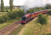 Ex LMS Jubilee 4-6-0 no. 45699 <I>Galatea</I> hauls the Wednesday <I>Fellsman</I> from Lancaster to Carlisle off the WCML at Farington Curve Jct on 2 July 2014 as it rounds the sweeping curve to join the East Lancs line towards Blackburn.<br><br>[John McIntyre 02/07/2014]