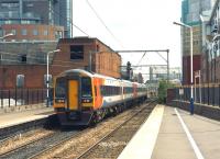 An East Midlands Trains service from Liverpool to Norwich formed by units 158770 and 158785 passes through the Manchester urban clutter at Deansgate on 5 July 2014 <br><br>[John McIntyre 05/07/2014]