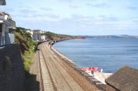 The main line at Dawlish in July 2014, looking almost back to what it was prior to the major storm damage suffered earlier this year, though with work still taking place in a number of areas and further changes currently at the planning stage [see recent news item].<br><br>[Bruce McCartney 09/07/2014]