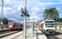 On 13th June, at the Bergen auf Ruegen junction, a single-car Pressnitztalbahn train forms the 17.40 service over the 12.5km branch to Lauterbach Mole, while to the left an EMU operates the 17.07 Ostseebad Binz to Stralsund RE (Regional Express) service. With the exception of the Lauterbach branch, all standard-gauge passenger services on Ruegen are electric.<br><br>[David Spaven 13/06/2014]