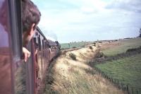 Photograph taken during the <I>Fife Coast Railtour</I> on 28 August 1965. The special, which started from St Enoch behind no 256 <I>Glen Douglas</I>, was handed over to J37 0-6-0 no 64569 at Leuchars Junction for the trip around the coast. The train is seen here near Anstruther on its way to Thornton Junction. [Ref query 6785] <br><br>[G W Robin 28/08/1965]