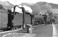 A Mallaig - Glasgow Queen Street train at the south end of Crianlarich station in the summer of 1960 behind B1 61355 (nearest) and Standard class 5 73105. <br><br>[David Stewart 18/06/1960]