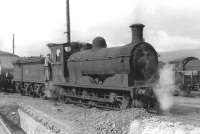 J36 0-6-0 no 65313 on Fort William shed in September 1961. Note the rear of the beaver-tail observation car on the far left of the picture.<br><br>[David Stewart 07/09/1961]