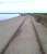 Long abandoned tracks running along South Shields south pier in 2014. Along the more landward half of the pier the track is laid level to the concrete surface, whereas on the seaward end the track stands some 20mm proud of the stone setts forming the surface up to the pier end lighthouse.<br><br>[David Pesterfield 06/07/2014]