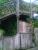 The cabin under the old footbridge at Phoenix Lane, Dunfermline, in 2014 [see image 47932] from which the level crossing gates and associated signals were operated. The external wooden telephone box is still intact and the metal plate on the cabin wall marks the position of the chimney from the stove inside. Brackets are visible in the footbridge latticework which supported the chimney extension above the bridge. [Information kindly provided by Mr Nairn, the last crossing keeper]<br><br>[Grant Robertson 05/07/2014]