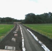 View south at Arniston towards Gorebridge on 15 May 2014, with sleepers awaiting tracklaying.<br><br>[John Yellowlees 15/07/2014]