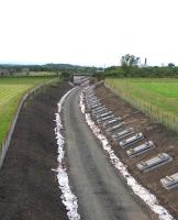 Track laying imminent at Arniston, between Newtongrange and Gorebridge, looking north towards Lady Victoria on 15th July 2014.<br><br>[David Spaven 15/07/2014]