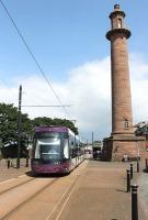 A southbound tram service has just left Fleetwood Ferry on 14 June and passes along Pharos Street on its way to Starr Gate. <I>Flexity</I> 004 is still on the turnaround loop, prior to rejoining the double track section along Fleetwood's main street. <br><br>[Mark Bartlett 14/06/2014]