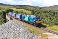 DRS has recently started running a Class 68 on the Stobart containers. Shiny new 68005 <I>Defiant</I> crosses Slochd Viaduct with the southbound train on 30 July heading for Mossend.<br><br>[John Gray 30/07/2014]