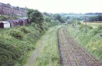 View north from Kilnknowe Place road bridge, Galashiels, in 1971, with the trackbed of the Peebles Loop on the left and the Waverley rails still in place. [See image 48187] <br><br>[Bruce McCartney //1971]