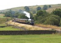 The <I>Cumbrian Mountain Express</I> on 26 July 2014 in the hands of A4 no 60009 <I>Union of South Africa</I> approaches Helwith Bridge between Settle and Horton-in-Ribblesdale. With hardly any exhaust and the safety valves lifting the A4 wasn't working hard as 57316 was providing assistance to avoid any risk of lineside fires in the dry conditions.<br><br>[John McIntyre 26/07/2014]