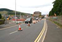The A7 Ladhope Vale at Galashiels (currently closed to northbound traffic) on 29 July 2014. On the left work is in progress on the new interchange, while activity to the right is on the site of the new station. Passenger interchange between buses and trains will be via the currently out-of-use pedestrian crossing. [See image 48198]<br><br>[John Furnevel 29/07/2014]