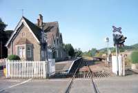 Looking west towards the Welsh border from the B4367 level crossing at Bucknell, Shropshire, in 2002. The attractive station, which opened in 1861, is on the Heart of Wales Line. <br><br>[Ewan Crawford //2002]