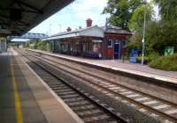 The Worcester platform building at Evesham station on a hot summer Saturday in July 2014 - a well kept station, but with a sparse train service.<br><br>[Ken Strachan 26/07/2014]