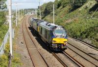 Two new DRS Class 68s, 68006 and 68007 (with Brush Type 4 47841 sandwiched between them), made a transfer run from Crewe Gresty Bridge to Kingmoor on 4th August. The northbound trio is seen here approaching Hest Bank level crossing. <br><br>[Mark Bartlett 04/08/2014]