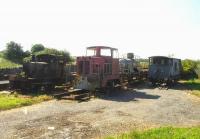 At the south end of the station yard at Llanerchymedd in July 2014 a compound contained two diesel shunting locos, a brakevan, and a tank wagon left over from an abortive line re-opening project.<br><br>[David Pesterfield 24/07/2014]