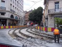 It happens here too! Tramworks underway at Place Grenette, Grenoble, in July 2014. The trams of Lines A and B normally run through here at a high frequency.<br><br>[Andrew Wilson 04/07/2014]