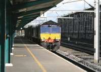 DRS 66304 draws into Carlisle platform 1 on 7th August 2014 for a crew change, following which it will resume its journey to Coatbridge Freightliner Terminal.<br><br>[Colin McDonald 07/08/2014]