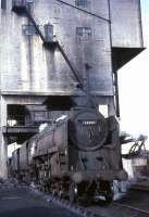 BR Standard class 9F 2-10-0 no 92015 under the coaling plant at Kingmoor shed in October 1966. Built at Crewe in 1954, the locomotive was withdrawn by BR 6 months after this photograph was taken. 92015 was cut up in the yard of Messrs McWilliams, Shettleston, in November 1967.<br><br>[G W Robin 08/10/1966]