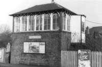 The signal box at Giffnock in 1960, complete with advertisement for the north side <I>Blue Trains</I>.  <br><br>[David Stewart //1960]