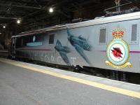 East Coast 91110 <I>Battle of Britain Memorial Flight</I> stands at the western end of platform 2 at Edinburgh Waverley on 14 July 2014 prior to propelling the 17.00 to Kings Cross.<br><br>[David Pesterfield 14/07/2014]