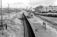 Looking over Bugle station on the Newquay branch in the 1970s.  View is south east towards Par from the A391 road bridge. [Ref query 12924]<br><br>[Ewan Crawford Collection 14/09/1976]