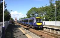 An Edinburgh-bound class 170 rushes through Dalmeny station on 26 August.<br><br>[Colin Miller 26/08/2014]