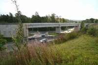 Traffic on the A7 negotiating Hardengreen Roundabout under the Borders Railway viaduct. View south on Saturday morning 30 August 2014. The new Eskbank station is currently under construction off to the left .  <br><br>[John Furnevel 30/08/2014]