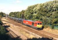 DBS 60010 heads east at Lostock Hall Junction on 27 August 2014 with the empty tar tank wagons returning to Lindsey Oil Refinery on Humberside.<br><br>[John McIntyre 27/08/2014]