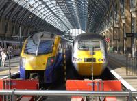 First Hull Trains Adelante unit 180113 alongside an HST at Kings Cross on 30 July 2014.<br><br>[Bill Roberton 30/07/2014]