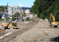 View north along the trackbed from Station Brae on 31 August 2014. The notable change to the Galashiels skyline on the left is the framework for the new transport interchange. [See image 48544].<br><br>[John Furnevel 31/08/2014]