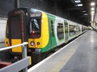 London Midland EMU 350267 about to leave platform 18 at Euston on 29 August 2014. The heavily loaded twelve coach train, running slightly late, is the 18.13 service to Birmingham New Street via Northampton.<br><br>[David Pesterfield 29/08/2014]