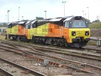 Colas Rail 70805 and 70809 stabled at Westbury during the late morning of 29 August 2014. Photographed looking west from the station platform.<br><br>[David Pesterfield 29/08/2014]