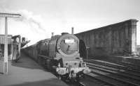 Train 1S97, a Saturday relief London Euston - Glasgow St Enoch service, stands at Carlisle platform 1 on 13 July 1963 behind Camden shed's Stanier Pacific no 46240 <I>City of Coventry</I>.<br><br>[K A Gray 13/07/1963]