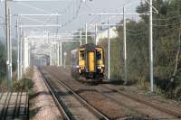 A clutter of catenary at Carmyle on 11 September as 156477 continues on its journey from Glasgow Central to Whifflet. Electrification of the route is scheduled for completion by the end of 2014.<br><br>[Colin McDonald 11/09/2014]