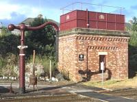 The 1991 installed water tank and column at the south end of Appleby station, bathed in sunshine on 16 July 2014.<br><br>[Bill Jamieson 16/07/2014]