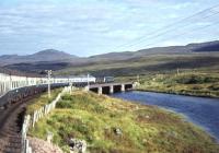 D5117 and D5120 cross the River Bran between Loch Achanalt and Loch a' Chuilinn on 13 September 1969 with the returning <I>Scottish Grand Tour No. 9.</I> The pair worked the special as far as Inverness where D5342 and D5071 took over for the final leg of the journey back to Edinburgh.<br><br>[Bill Jamieson 13/09/1969]