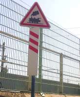 The French highway authorities seem to share our belief that the motoring public still recognize the symbol of a steam engine. Sign by road crossing at the TGV maintenance depot at Pantin on 5 August.<br><br>[Ken Strachan 05/08/2014]